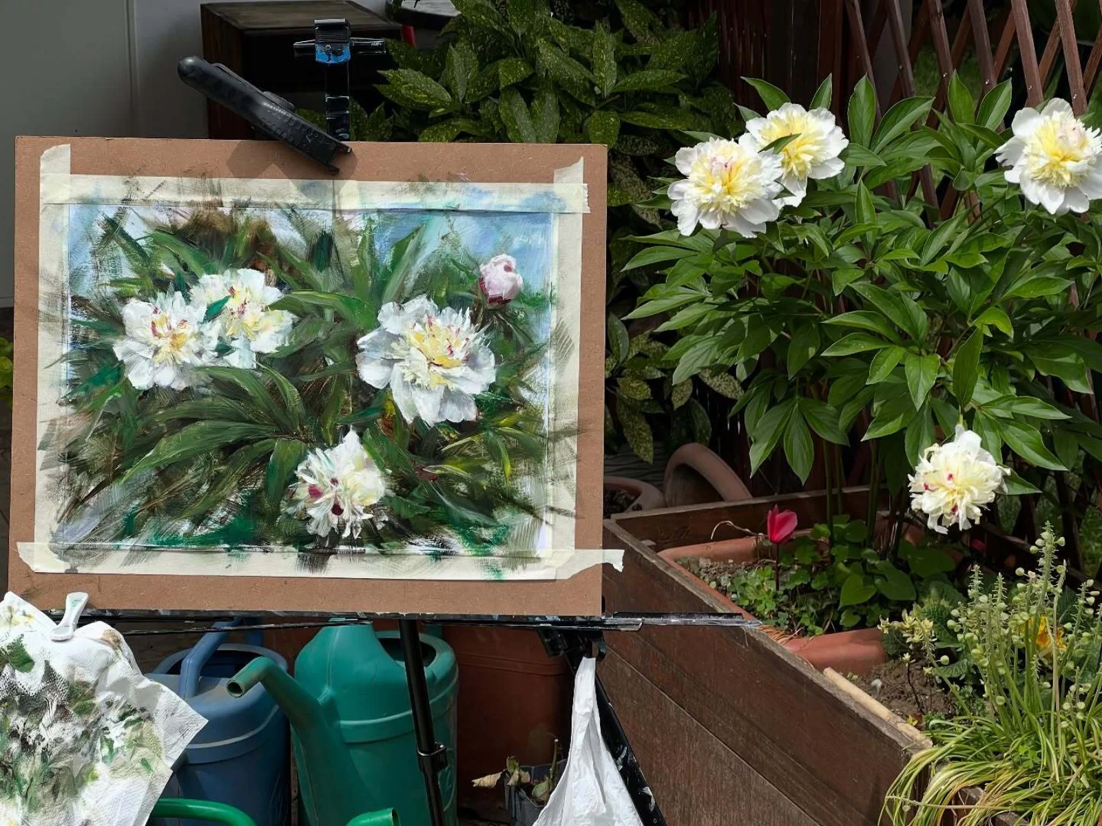 Peonies in a garden, plein-air oil study by Joe Rena